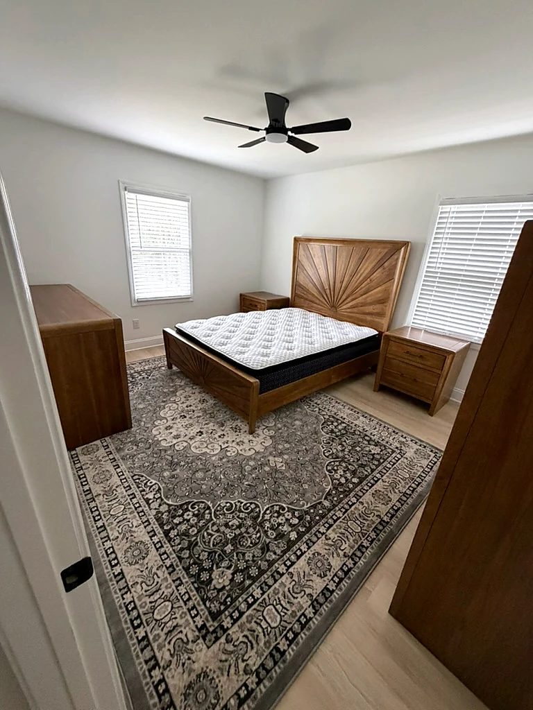 Chandler House bedroom before staging, with mattress without bedding